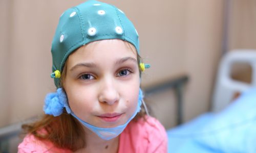 Photo of a girl with disability in a hospital room.