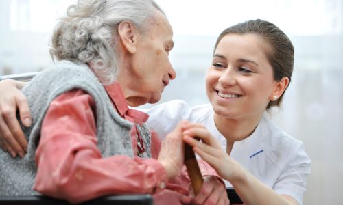 Photo of an older woman with a nurse