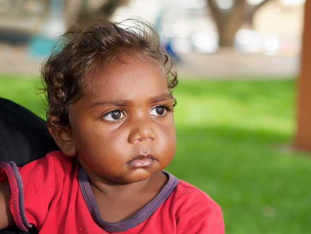 Aboriginal girl looking into the distance.