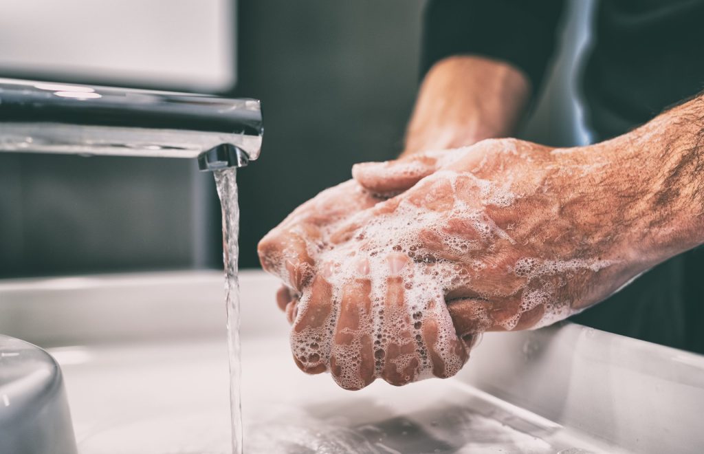 Photo of a person washing their hands.