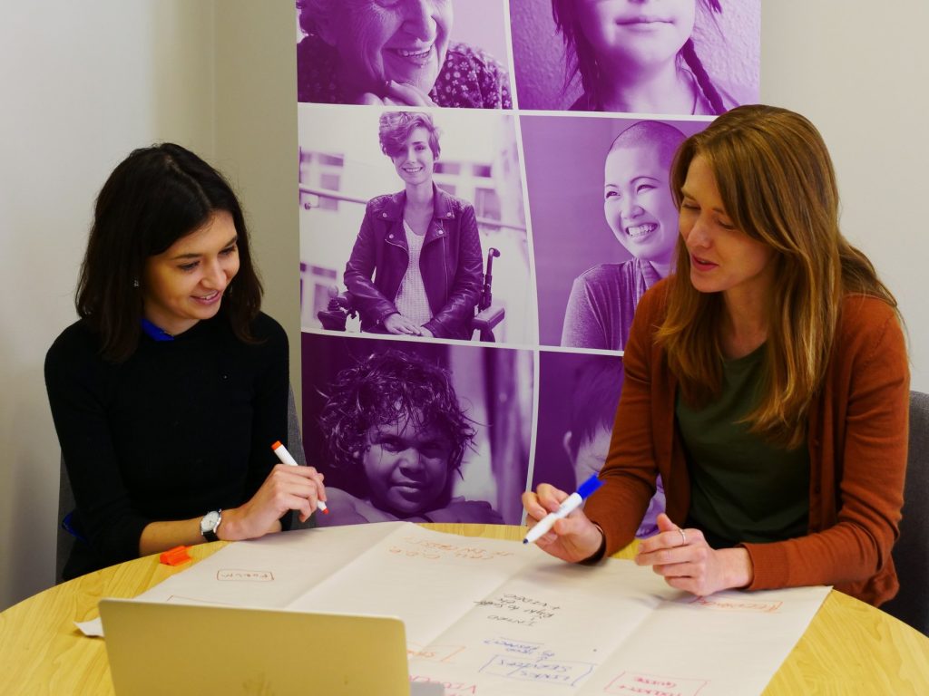 Two WWDA employees working together