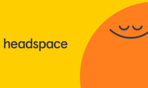 Bright yellow background a big orange emoji looking calm with the word headspace.