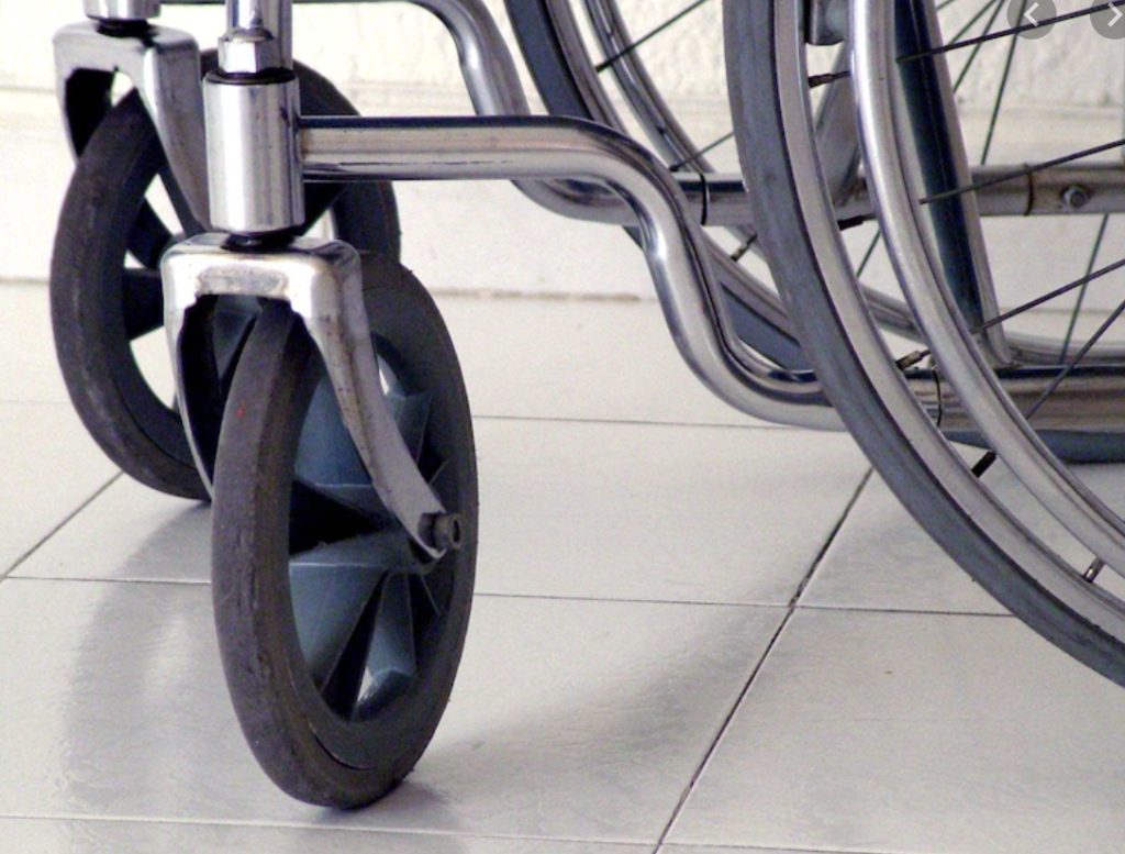 A wheelchair on a tile floor