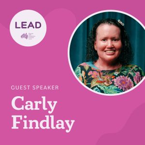 Bright pink square tile with a round purple LEAD logo, and a circle insert of a woman with a red face, short curly hair with a small bow in it. She's wearing a bright floral top and a sparkly jeweled necklace. Text reads: "Guest Speaker Carly Findlay".