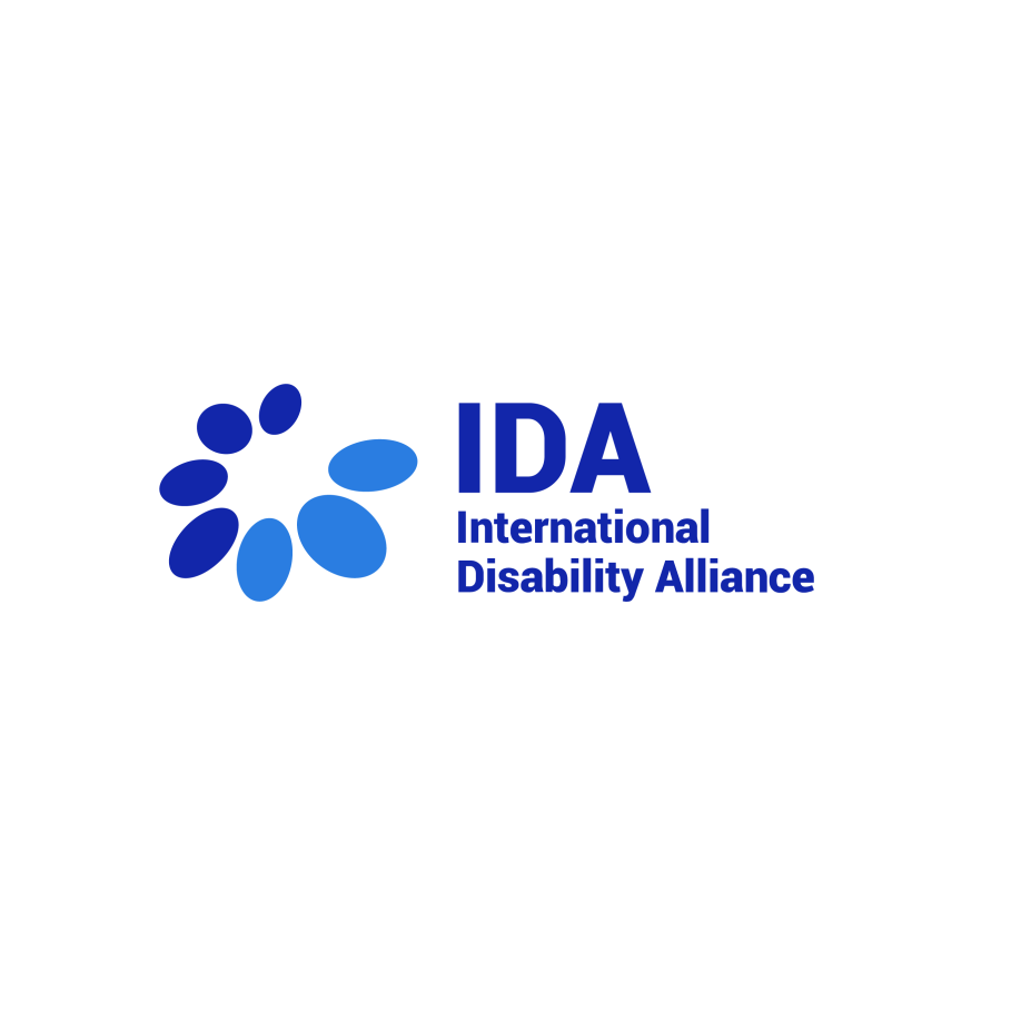 An image of the International Disability Alliance logo. On a white background, blue text reads "IDA International Disability Alliance." An illustration of multiple blue ovals in different shades is next to the text.