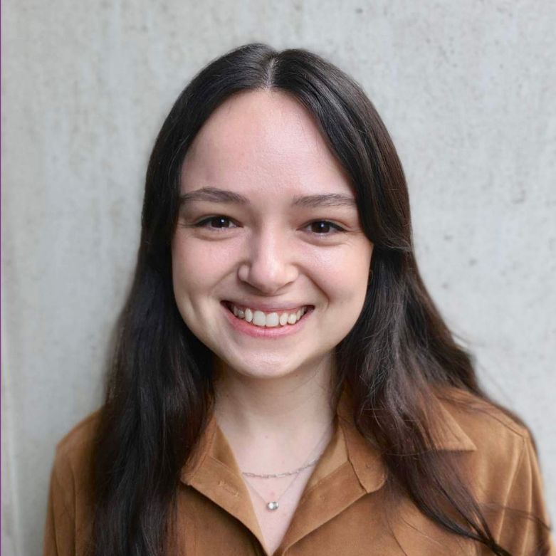 Photo of Sophie Cusworth who has long brown hair and wearinng a brown shirt.