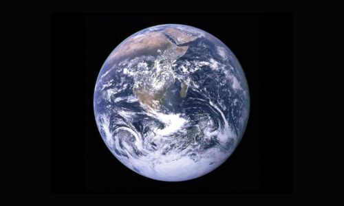 [Image: Black background with a stock image of the Earth in space taken by NASA.]